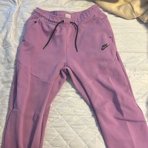 purple nike tech pants
